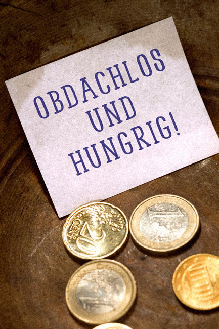 Obdachlos und hungrig Münzen